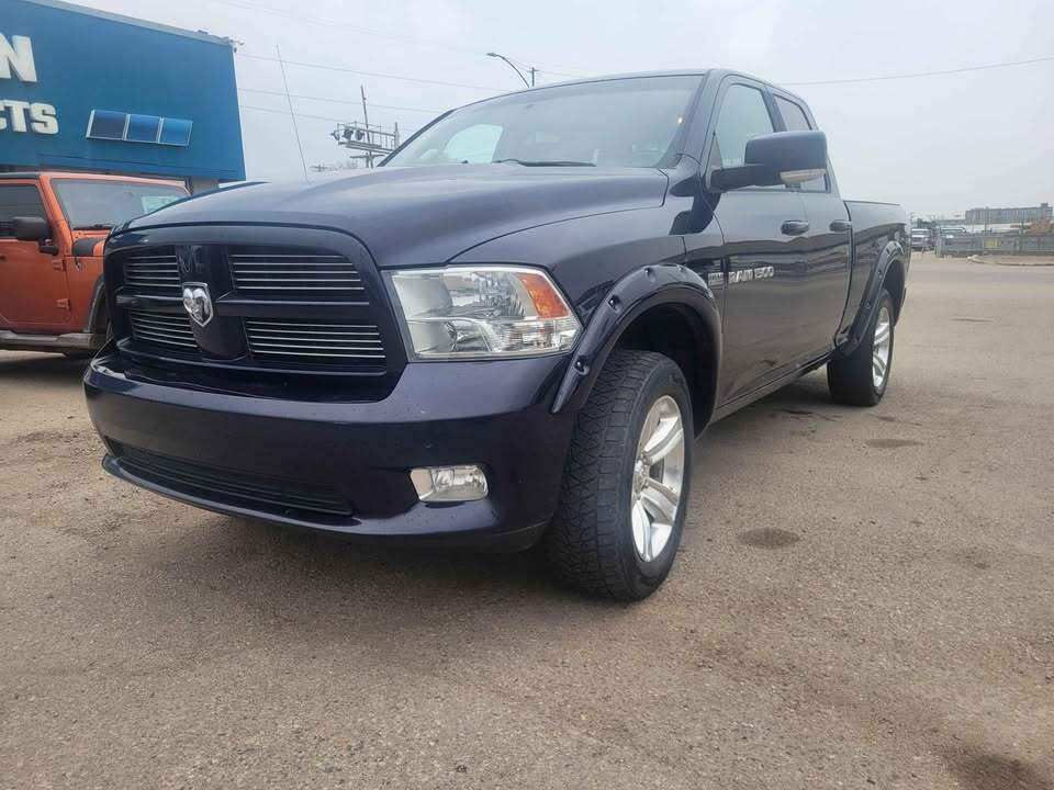 2012 Ram 1500 4WD Quad Cab 140.5  Sport