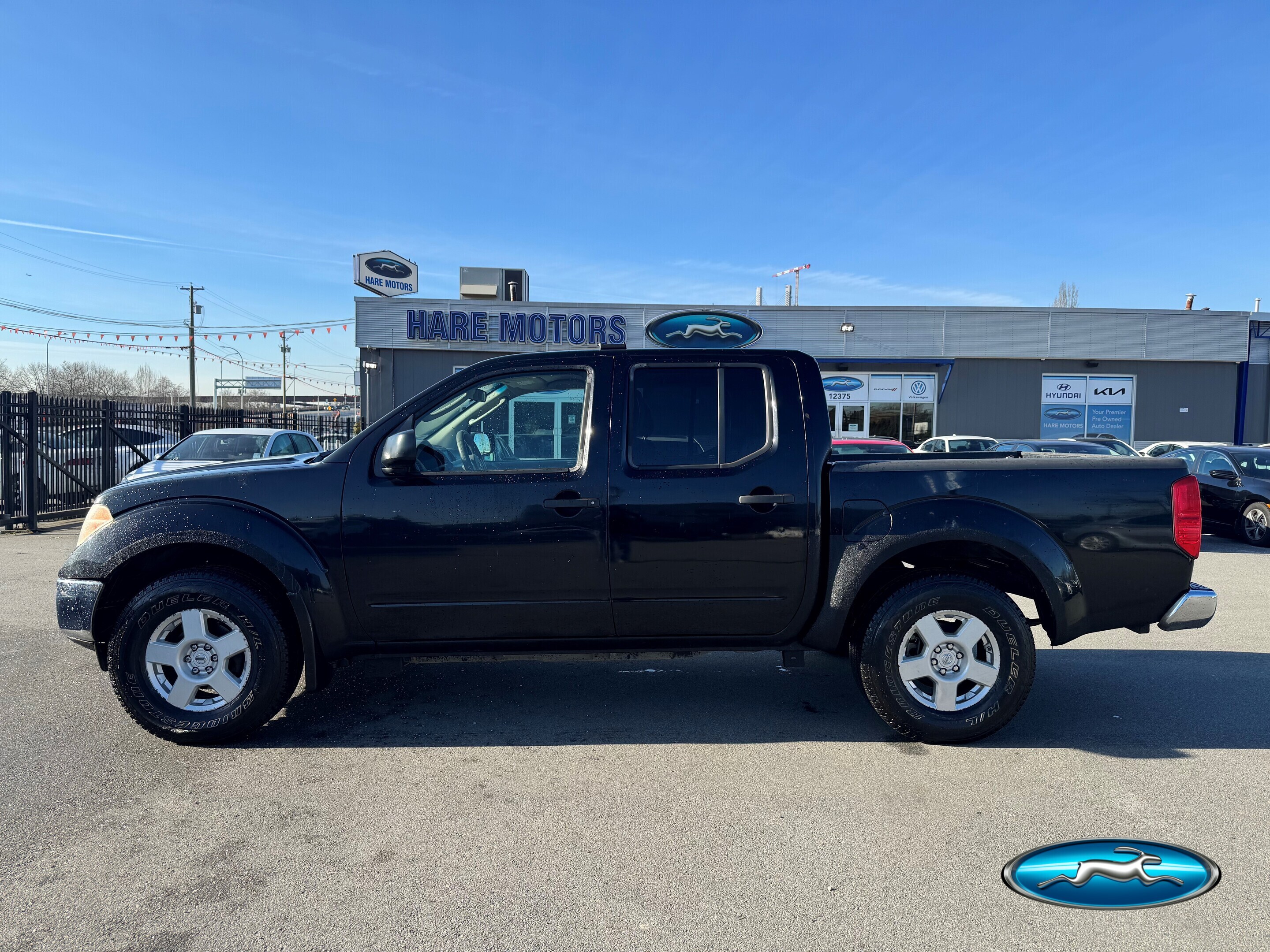 Black 2006 Nissan Frontier SE 4dr Crew Cab 4WD SB with automatic Pickup Truck Four-Wheel Drive 5-Speed Automatic