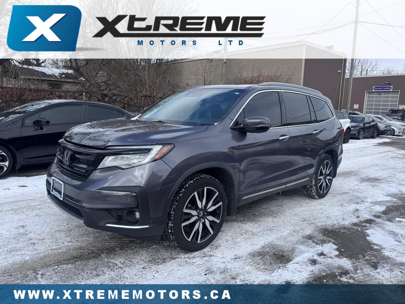 Honda Pilot Touring AWD with Rear Captain's Chairs