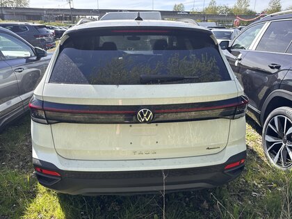 used 2025 Volkswagen Taos car, priced at $36,875