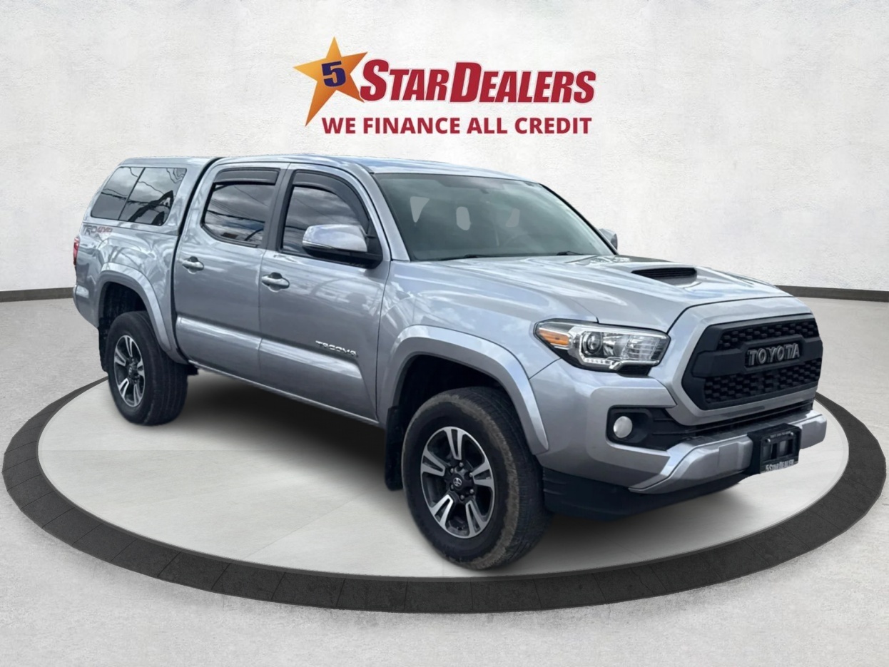 Silver 2016 Toyota Tacoma Double Cab V6 TRD Sport 4WD Pickup Truck Four-Wheel Drive 6-Speed Manual