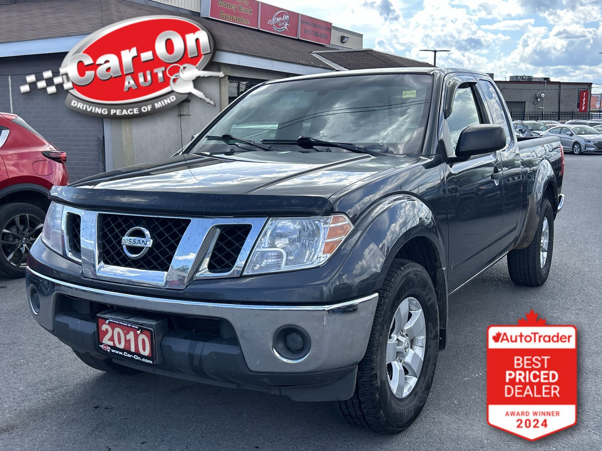 Gray 2010 Nissan Frontier Pickup Truck Four-Wheel Drive Manual