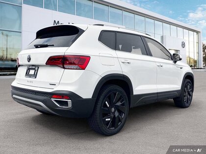 used 2024 Volkswagen Taos car, priced at $38,489